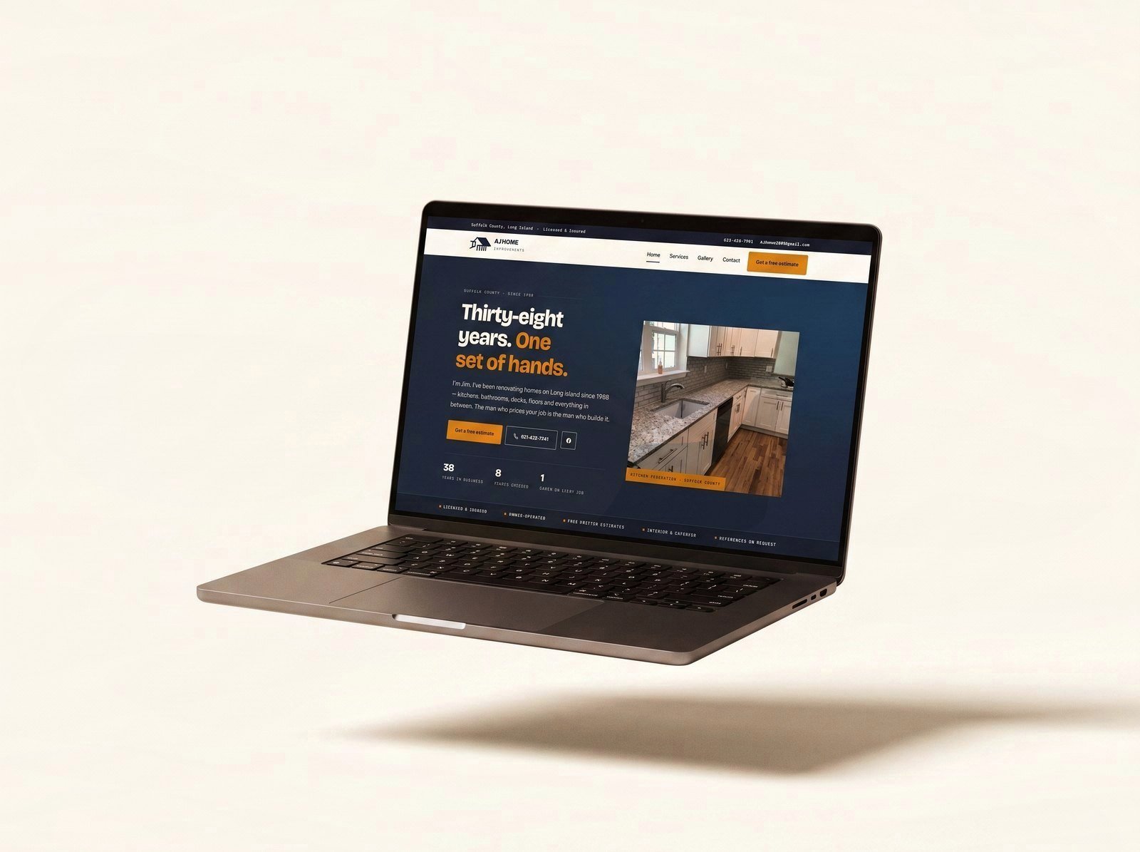 AJ Home Improvements website on a floating laptop