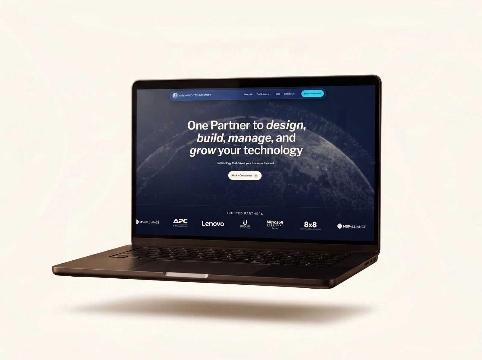 Hardwired Technologies website on a laptop and phone
